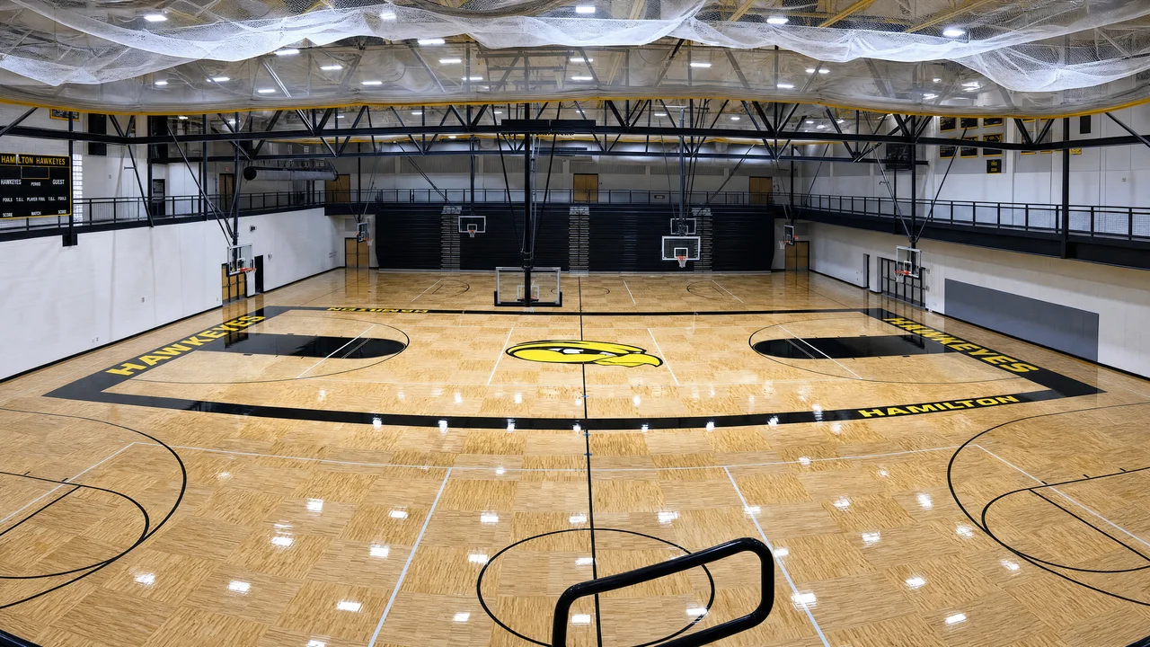 High school hardwood basketball gym with painted court lines
